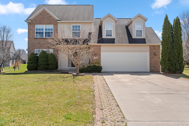 traditional-style home featuring concrete driveway, brick siding, a front yard, and roof with shingles