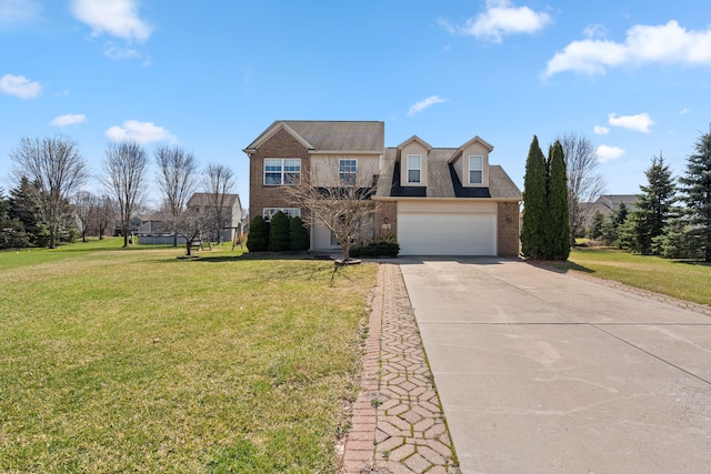 traditional-style house with concrete driveway, brick siding, a front yard, and a garage