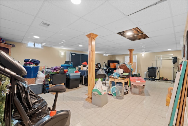 below grade area with visible vents and a drop ceiling