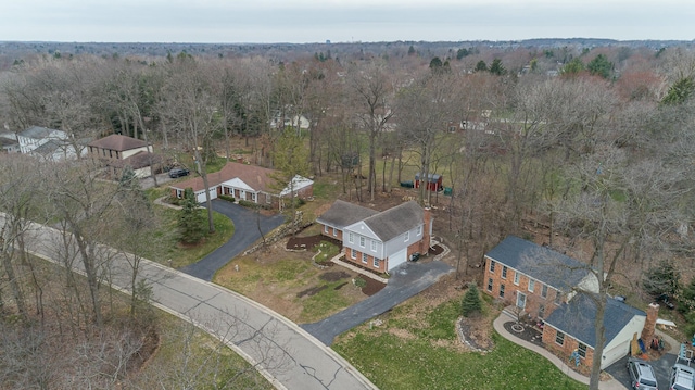 drone / aerial view featuring a forest view