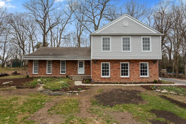 view of front of property featuring brick siding