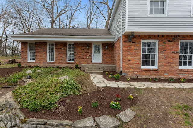 view of front of property featuring brick siding