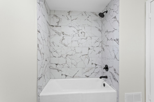 full bathroom with washtub / shower combination and visible vents