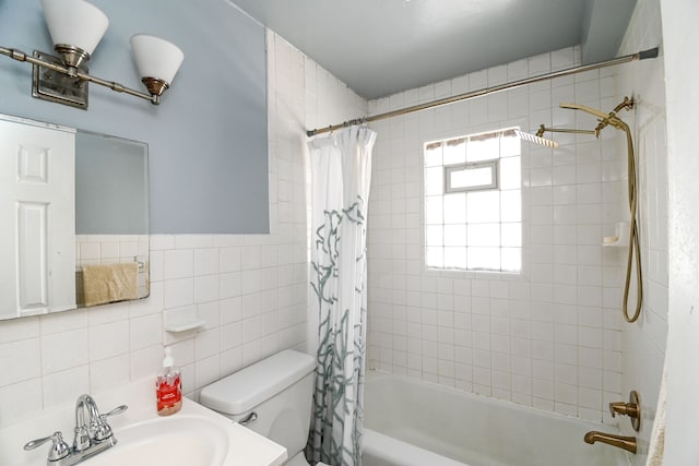 bathroom featuring a sink, tile walls, shower / bathtub combination with curtain, toilet, and backsplash