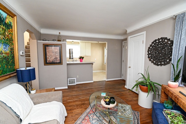 living area featuring wood finished floors and baseboards