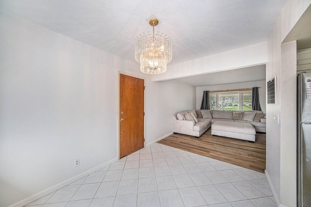 2771 Park Dr, Adrian, MI 49221 - living room with baseboards, light tile patterned flooring, and a chandelier