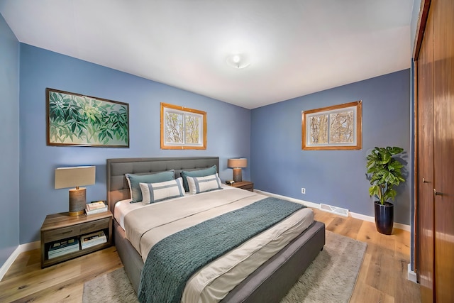 2771 Park Dr, Adrian, MI 49221 - bedroom with baseboards, visible vents, and light wood-style flooring