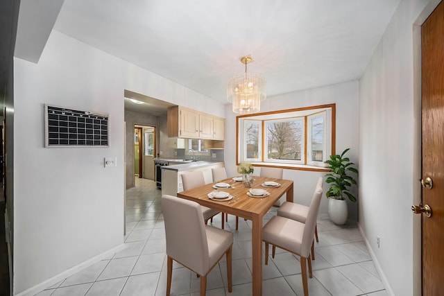 2771 Park Dr, Adrian, MI 49221 - dining space with a chandelier, baseboards, light tile patterned floors, and visible vents