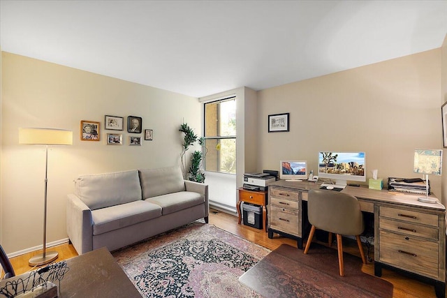 home office with wood finished floors