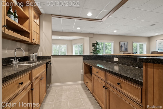 1171 Deer Path Trl, Oxford, MI 48371 - kitchen featuring a sink, brown cabinets, dishwasher, dark stone counters, and recessed lighting