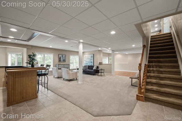 1171 Deer Path Trl, Oxford, MI 48371 - living room with stairway, light colored carpet, healthy amount of natural light, baseboards, and recessed lighting