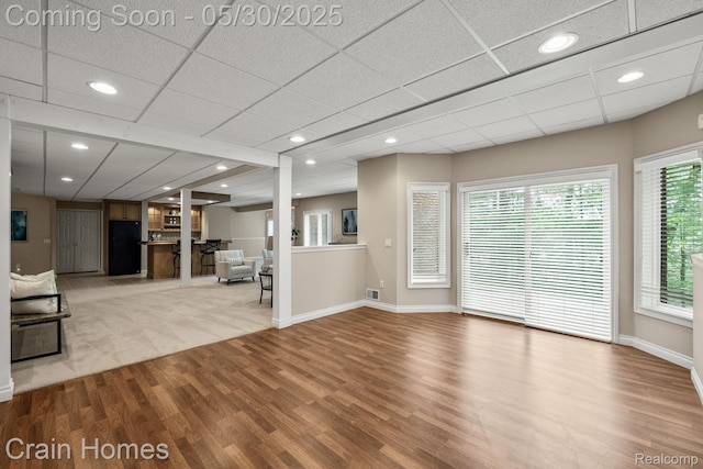 1171 Deer Path Trl, Oxford, MI 48371 - unfurnished living room with wood finished floors, healthy amount of natural light, baseboards, and recessed lighting