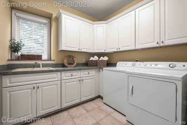 1171 Deer Path Trl, Oxford, MI 48371 - laundry room featuring cabinet space, independent washer and dryer, and light tile patterned flooring