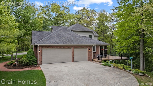 1171 Deer Path Trl, Oxford, MI 48371 - view of front of property with brick siding, a garage, concrete driveway, and roof with shingles