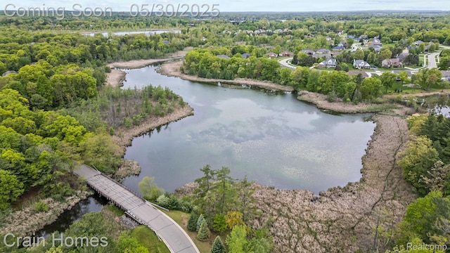 1171 Deer Path Trl, Oxford, MI 48371 - aerial view of property and surrounding area with a large body of water and a heavily wooded area