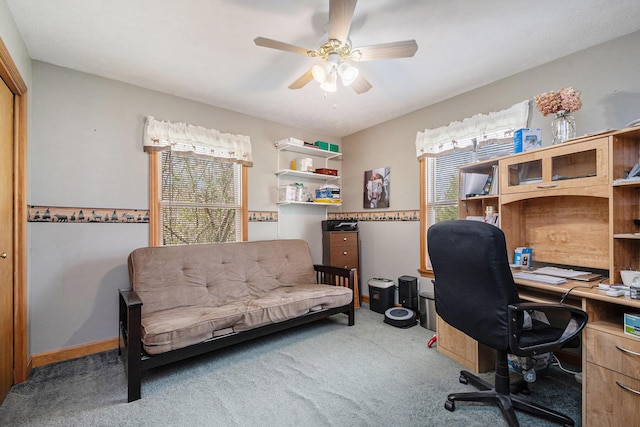 carpeted home office with ceiling fan