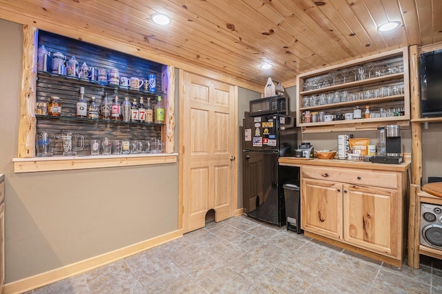 bar featuring wood ceiling, recessed lighting, a bar, and freestanding refrigerator
