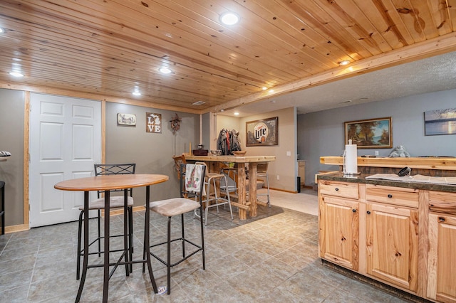 dining room featuring baseboards, recessed lighting, light tile patterned floors, and wooden ceiling