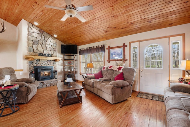 living area with a ceiling fan, hardwood / wood-style floors, lofted ceiling, and wood ceiling