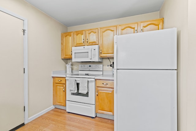 kitchen with light wood-style floors, white appliances, light brown cabinetry, baseboards, and light countertops