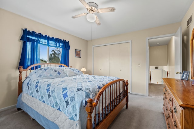 bedroom featuring a closet, a ceiling fan, carpet floors, and baseboards