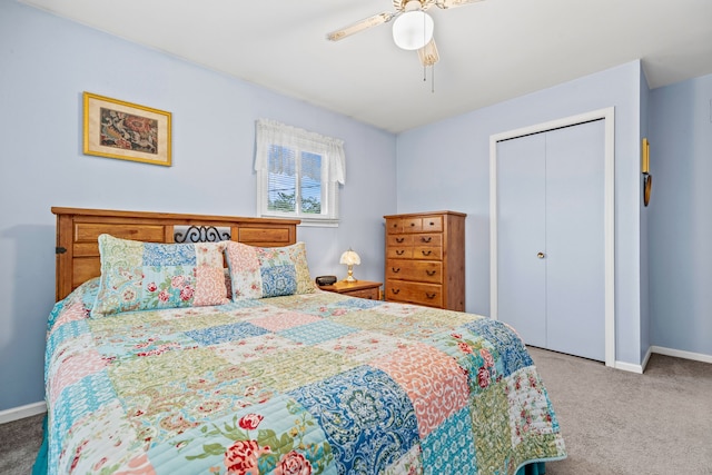 carpeted bedroom with baseboards, a ceiling fan, and a closet