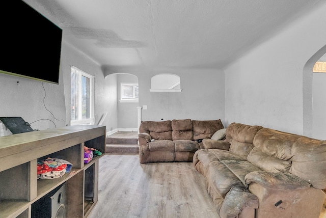 16171 Ilene St, Detroit, MI 48221 - living area featuring arched walkways and wood finished floors