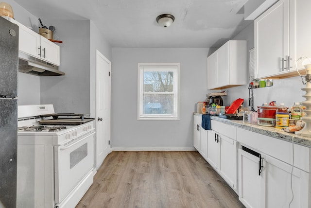16171 Ilene St, Detroit, MI 48221 - kitchen featuring under cabinet range hood, light wood finished floors, white cabinetry, and gas range gas stove