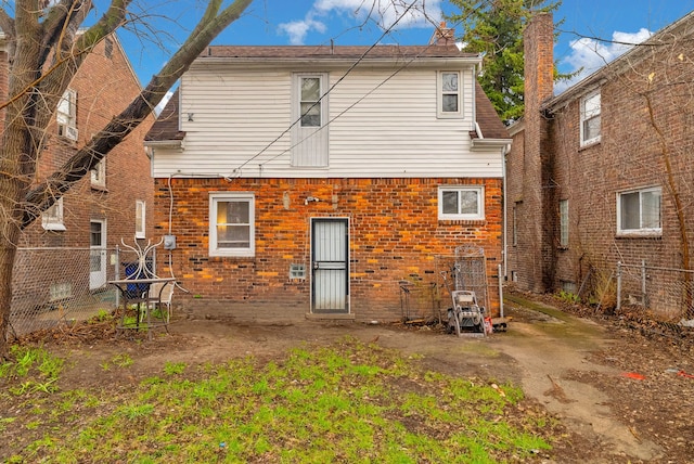 16171 Ilene St, Detroit, MI 48221 - back of house featuring brick siding and fence