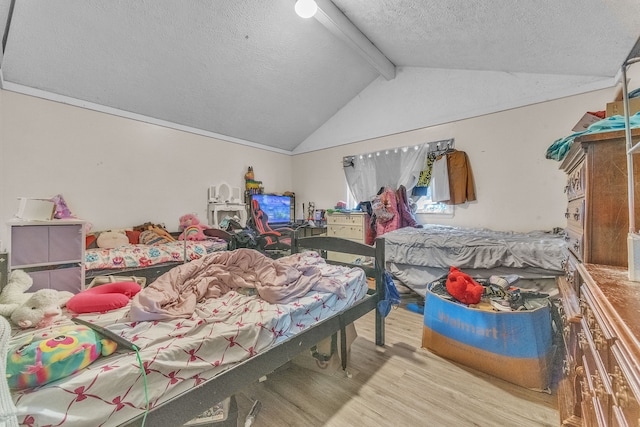 19965 Barlow St, Detroit, MI 48205 - bedroom featuring a textured ceiling, lofted ceiling with beams, and wood finished floors