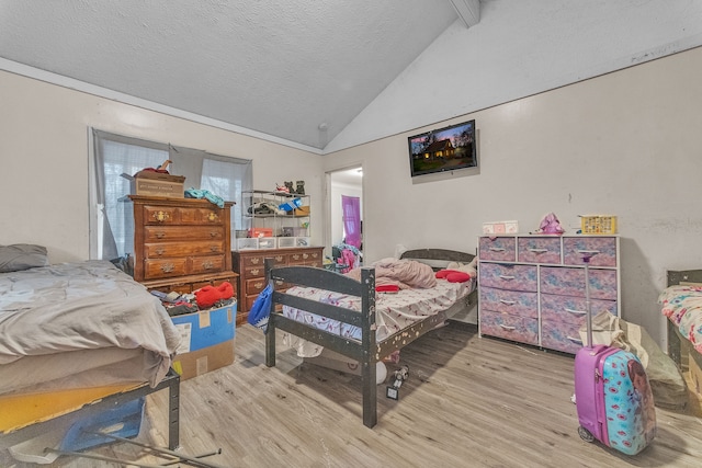 19965 Barlow St, Detroit, MI 48205 - bedroom featuring a textured ceiling, wood finished floors, and lofted ceiling