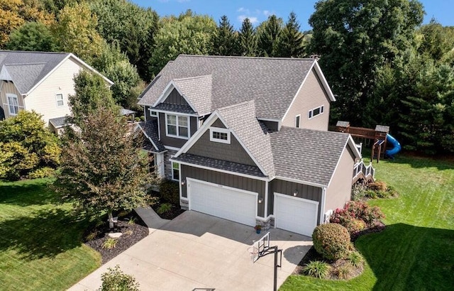 7198 Limerick Ln SW, Byron Center, MI 49315 - view of front of house featuring board and batten siding, a garage, driveway, a front lawn, and a shingled roof