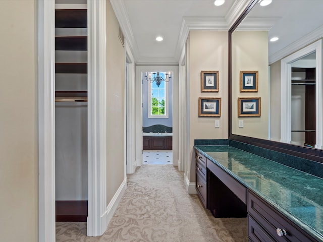 bathroom with recessed lighting, an inviting chandelier, vanity, baseboards, and ornamental molding