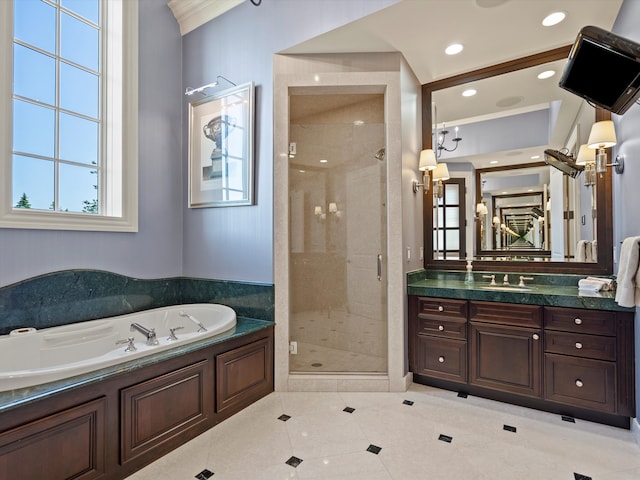 full bathroom featuring a garden tub, a shower stall, vanity, and a healthy amount of sunlight