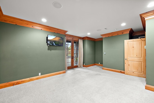 carpeted spare room with ornamental molding, recessed lighting, and baseboards