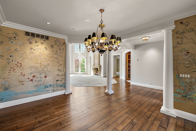 unfurnished dining area with crown molding, visible vents, hardwood / wood-style floors, baseboards, and an inviting chandelier