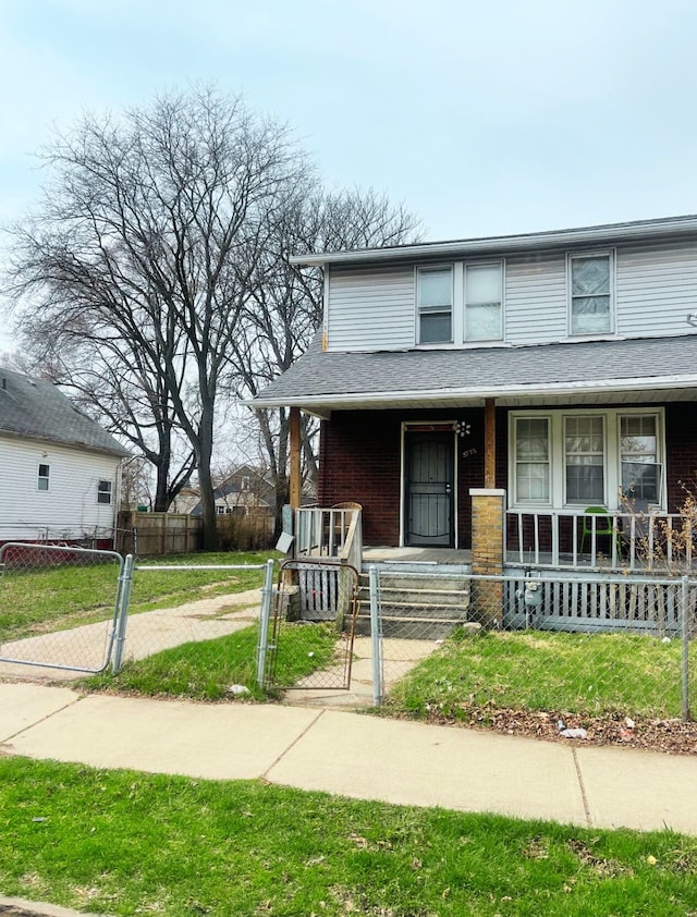 view of front of house with covered porch, a fenced front yard, and a gate