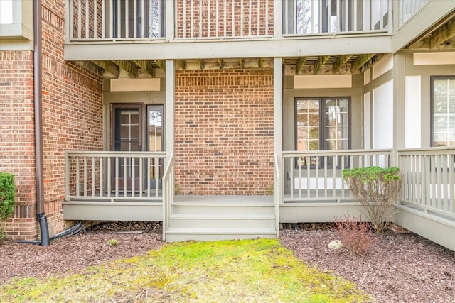 775 Deer Ct, Plymouth, MI 48170 - property entrance featuring brick siding and a porch