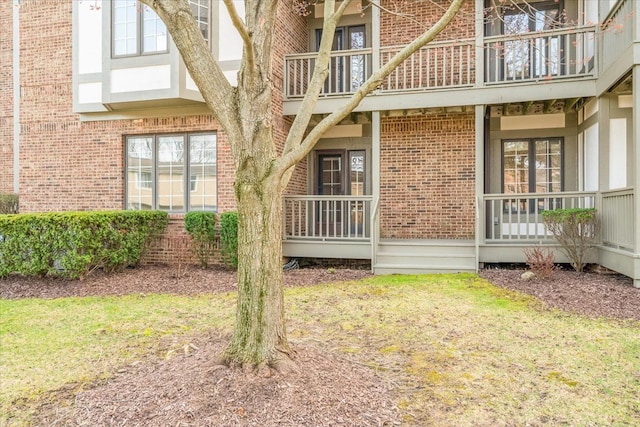 775 Deer Ct, Plymouth, MI 48170 - view of property exterior with a porch, brick siding, and a balcony