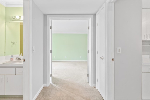 775 Deer Ct, Plymouth, MI 48170 - hall with baseboards, light colored carpet, and a sink