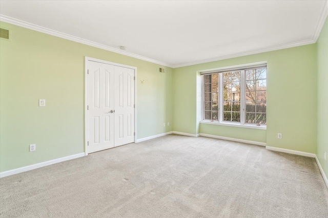 775 Deer Ct, Plymouth, MI 48170 - carpeted empty room with baseboards, ornamental molding, and visible vents
