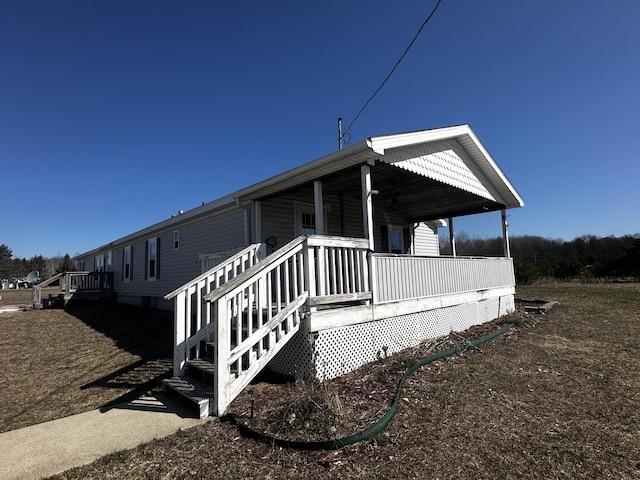 view of property exterior featuring a porch