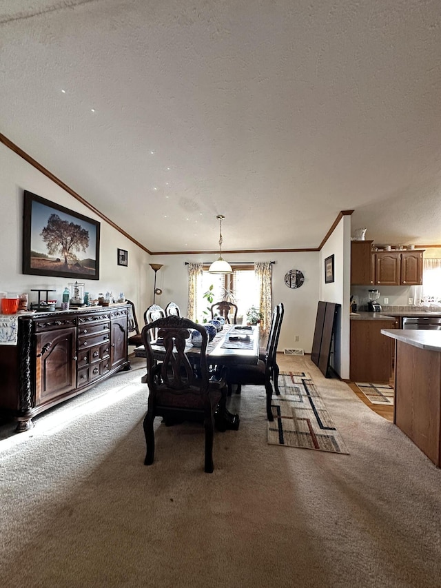 dining room with crown molding, light carpet, and plenty of natural light