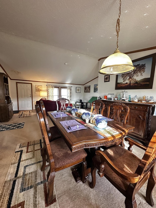 carpeted dining area featuring vaulted ceiling