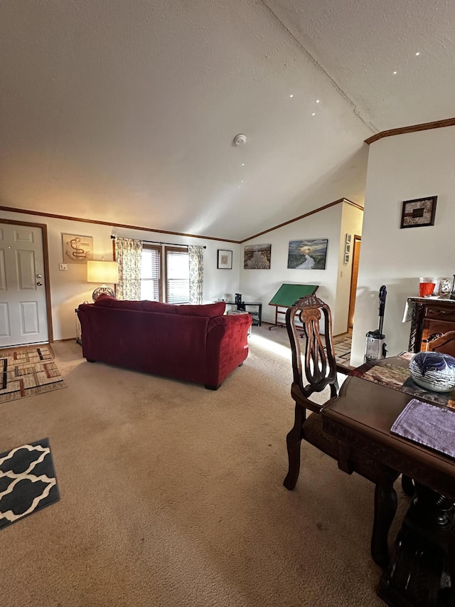 living room with lofted ceiling, a textured ceiling, ornamental molding, and light colored carpet