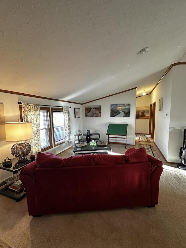 carpeted living room featuring a textured ceiling, baseboards, lofted ceiling, and ornamental molding