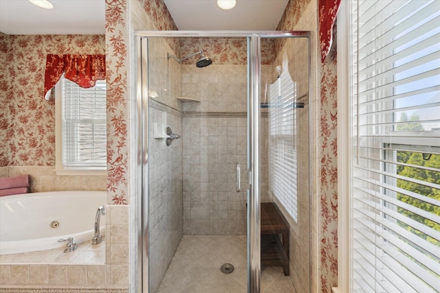 full bathroom featuring a whirlpool tub, a stall shower, and wallpapered walls