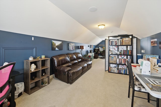 carpeted living area featuring lofted ceiling