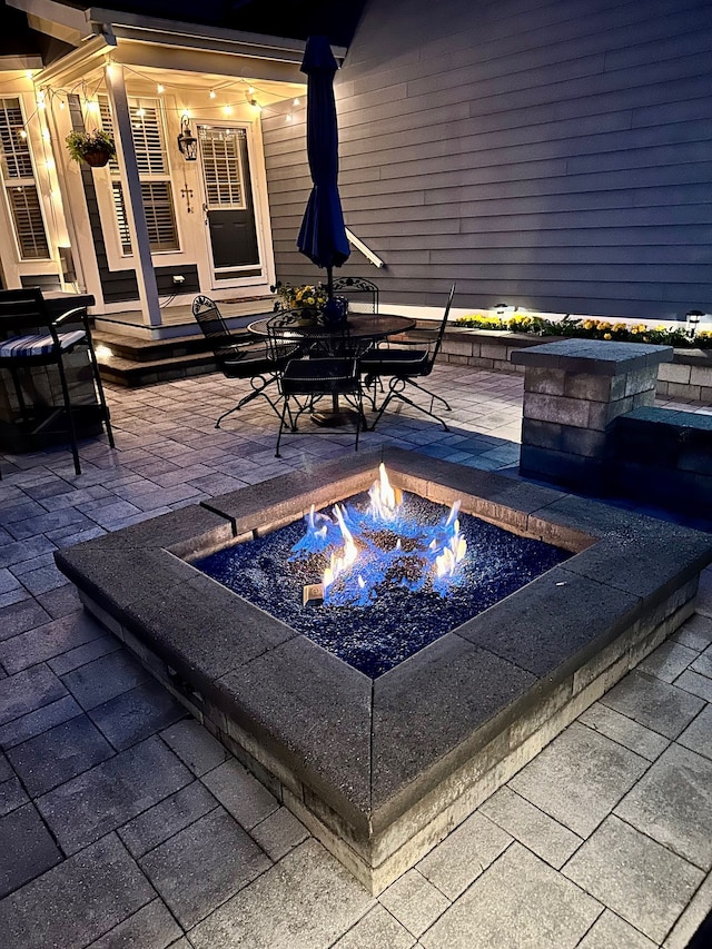1728 Town Commons Dr, Howell, MI 48855 - view of patio with an outdoor fire pit