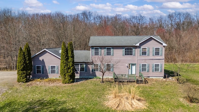 57480 72nd Ave, Hartford, MI 49057 - back of house featuring a yard and a view of trees